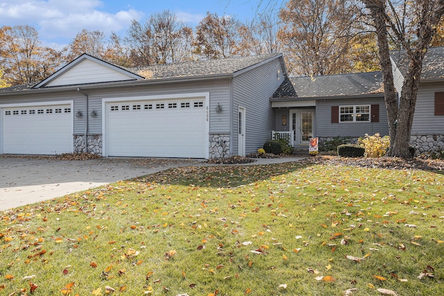 view of front facade with a front yard and a garage