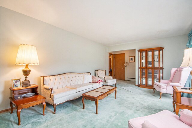 carpeted living room with a baseboard heating unit