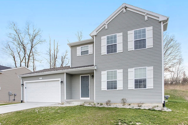 view of front of home featuring a front lawn and a garage