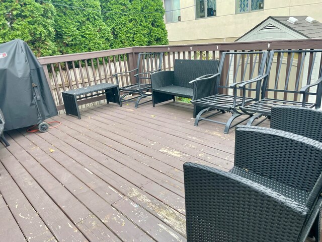 deck featuring a grill