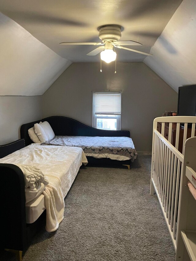 bedroom with lofted ceiling, carpet flooring, and ceiling fan