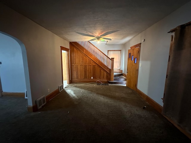 interior space with ceiling fan