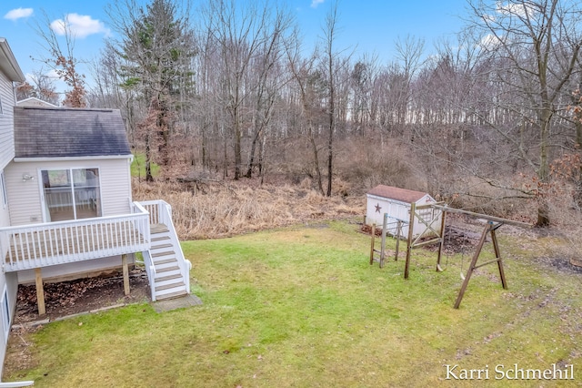 view of yard with a shed and a wooden deck