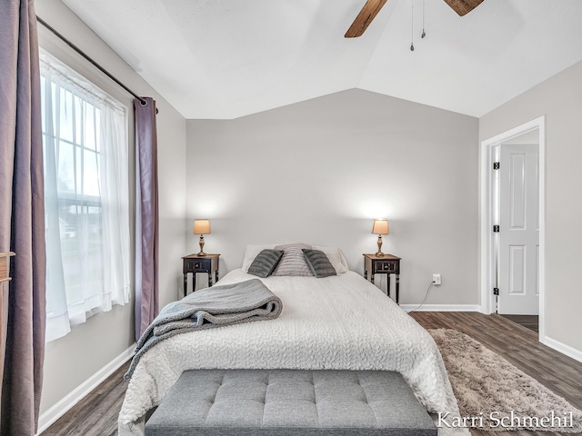 bedroom with ceiling fan, dark hardwood / wood-style floors, and lofted ceiling