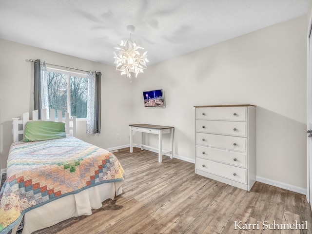 bedroom with light hardwood / wood-style floors