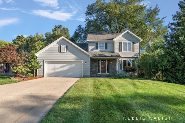 view of property with a garage and a front lawn