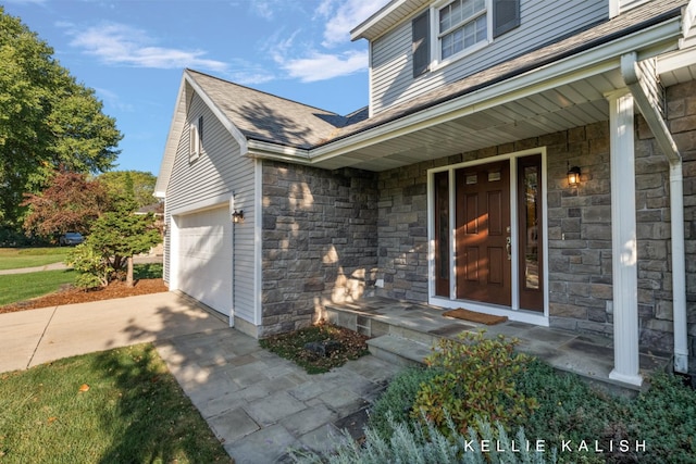 entrance to property featuring a garage