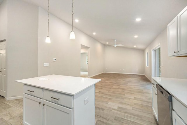 kitchen with white cabinetry, light hardwood / wood-style flooring, dishwasher, and pendant lighting