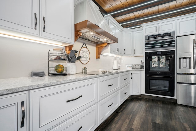 kitchen with wood ceiling, dark hardwood / wood-style floors, black appliances, white cabinetry, and premium range hood