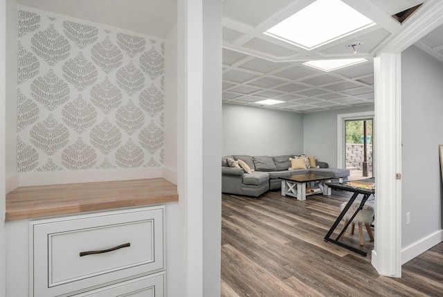 living room with hardwood / wood-style floors and coffered ceiling