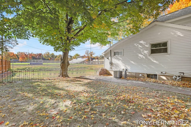 view of yard featuring central AC unit