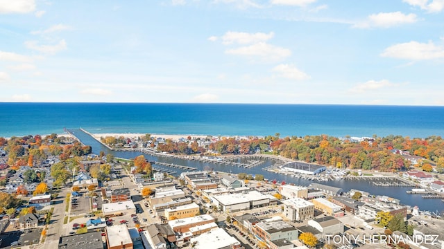 birds eye view of property with a water view