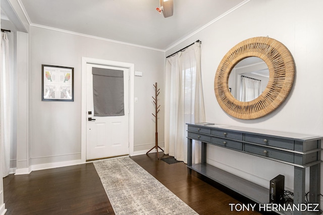 foyer entrance featuring dark hardwood / wood-style flooring and crown molding