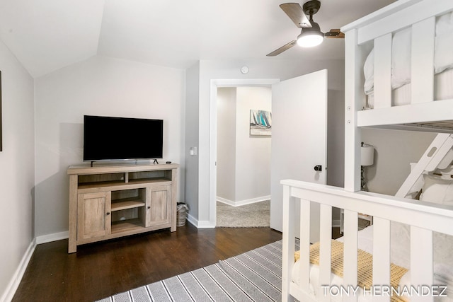 bedroom with dark wood-type flooring, ceiling fan, and lofted ceiling