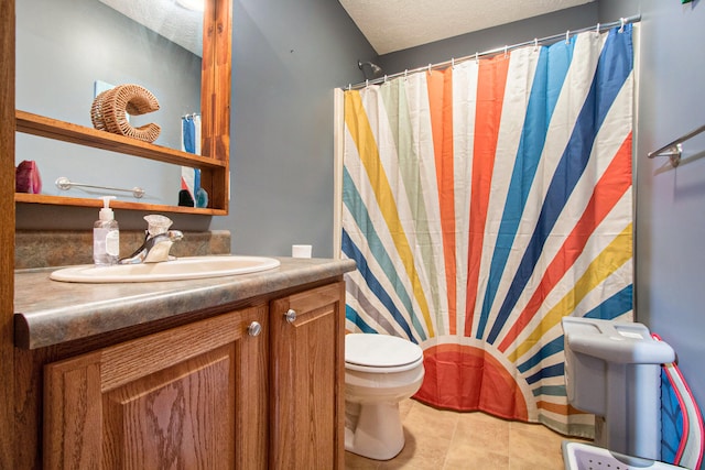 bathroom featuring a textured ceiling, toilet, tile patterned floors, a shower with curtain, and vanity