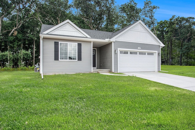 view of front facade with a garage and a front lawn