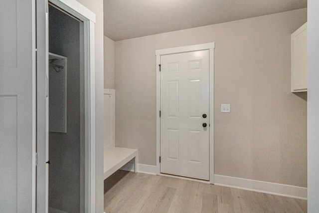 mudroom with light hardwood / wood-style floors