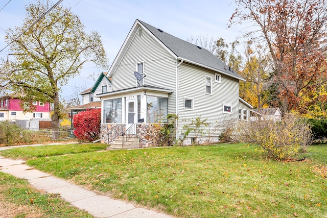 view of side of home featuring a yard