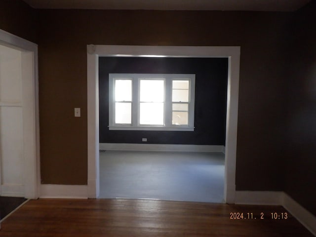 empty room with wood-type flooring