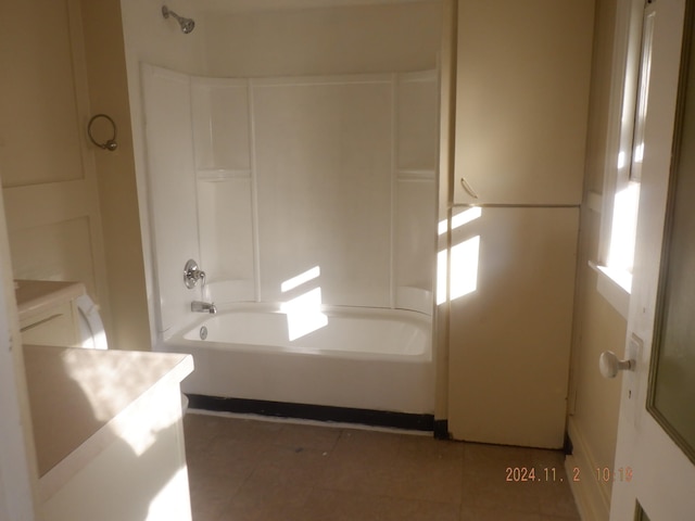 bathroom featuring vanity, bathtub / shower combination, and tile patterned flooring