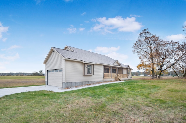 exterior space with a garage and a lawn