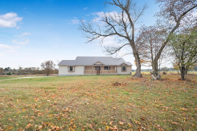 ranch-style house with a front yard