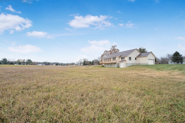 view of yard with a rural view