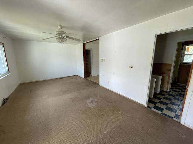 carpeted empty room with ceiling fan