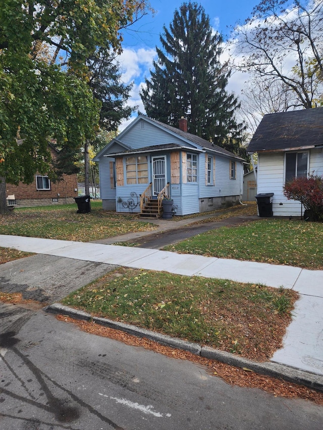 bungalow with a front lawn