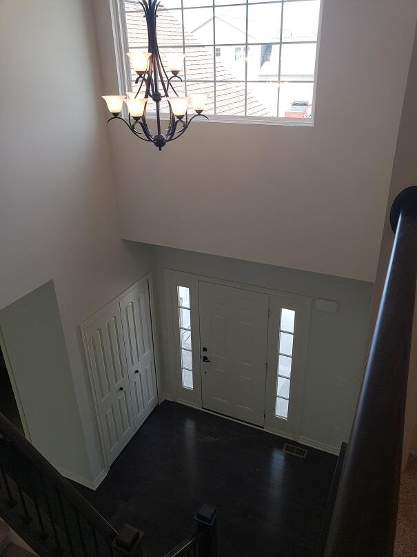 foyer featuring a chandelier