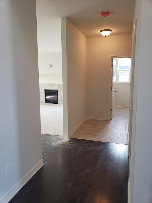 hall with wood-type flooring