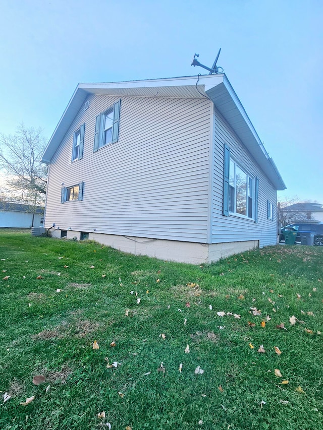 view of property exterior with a yard