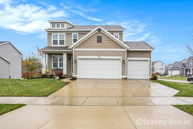 craftsman-style house featuring a garage and a front lawn