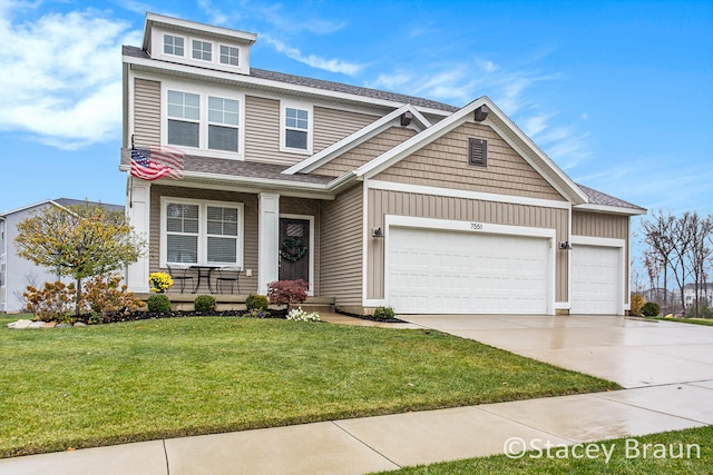 craftsman-style house with a garage and a front yard