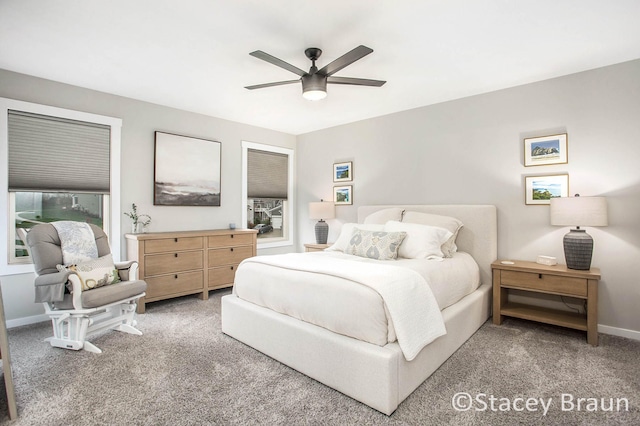 bedroom with ceiling fan and carpet floors