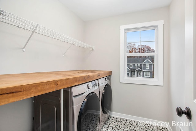 laundry room featuring separate washer and dryer