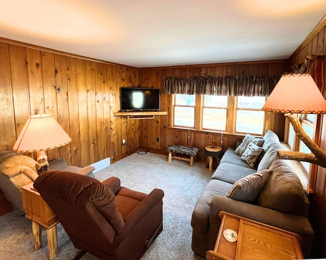 living room with carpet floors and wood walls