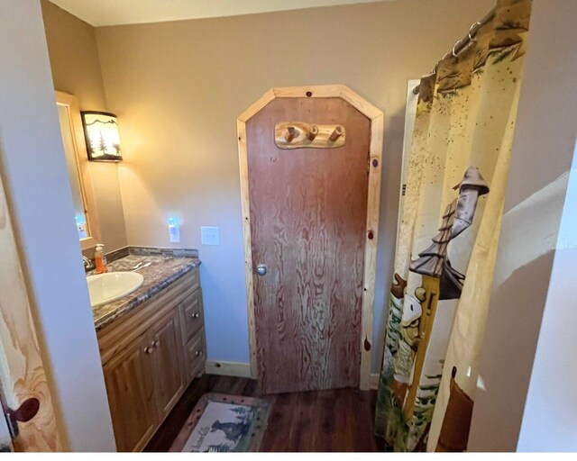 bathroom featuring vanity and hardwood / wood-style flooring