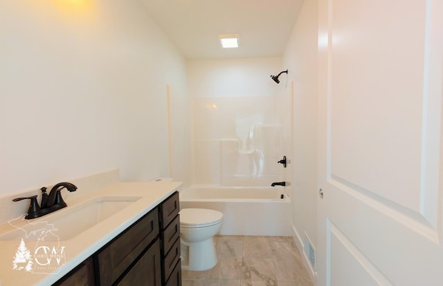 full bathroom featuring washtub / shower combination, vanity, and toilet