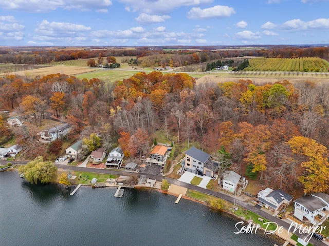 birds eye view of property featuring a water view and a rural view