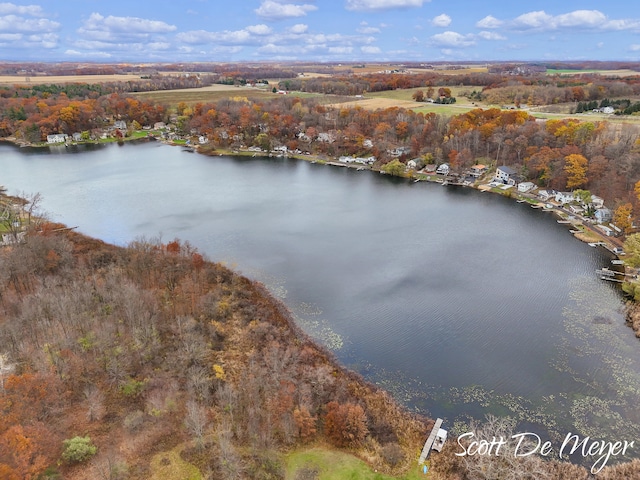 birds eye view of property featuring a water view