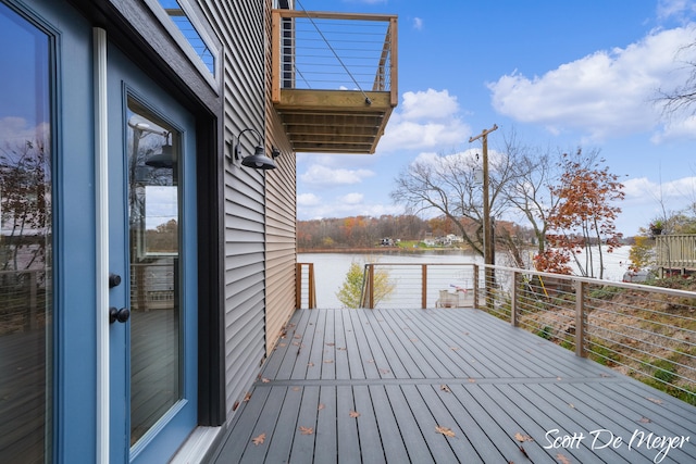 wooden deck featuring a water view