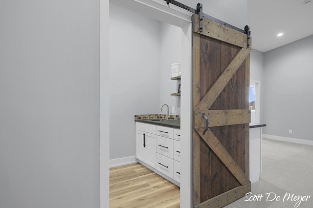 interior space with wood-type flooring and sink