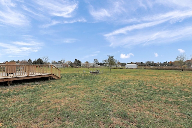 view of yard featuring a wooden deck