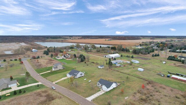 bird's eye view featuring a rural view and a water view