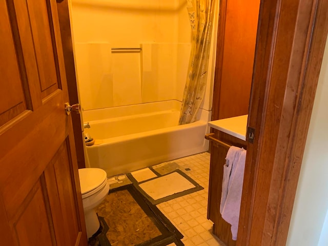 full bathroom featuring vanity, shower / tub combo, and toilet