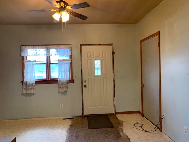 foyer entrance with ceiling fan