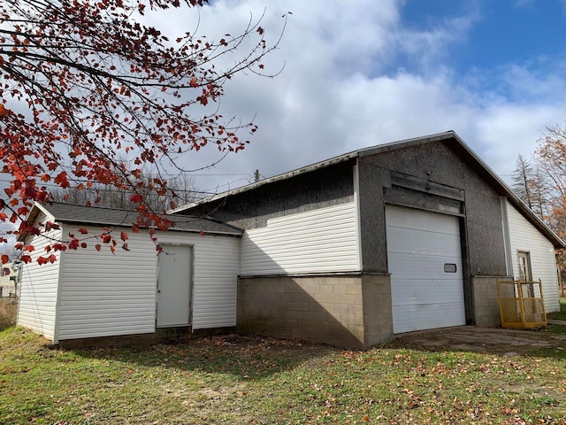 garage featuring a yard