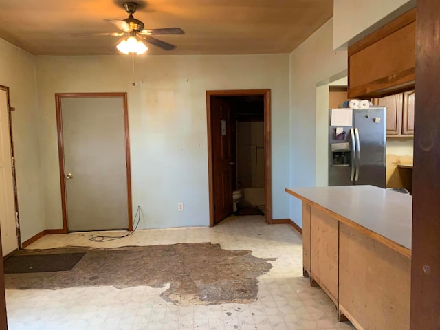 kitchen featuring ceiling fan and stainless steel fridge