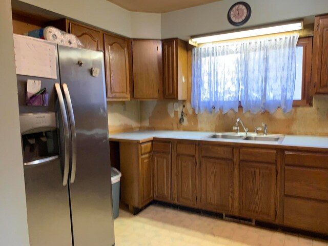 kitchen with sink and stainless steel fridge